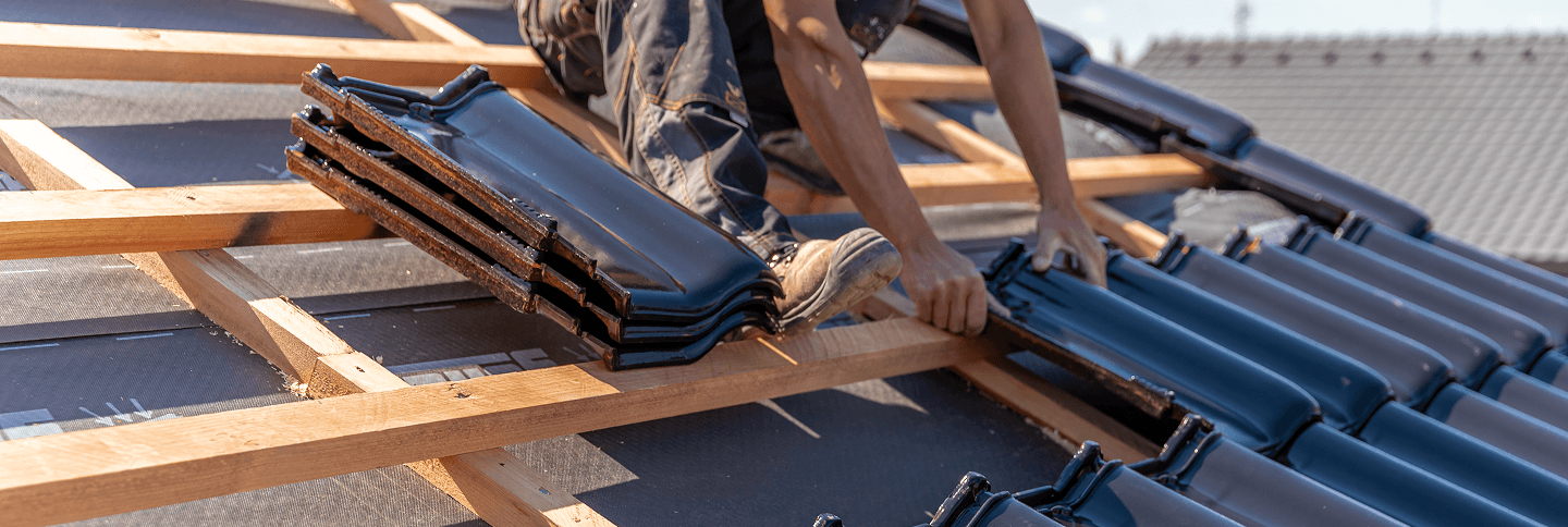 Workers repairing a house