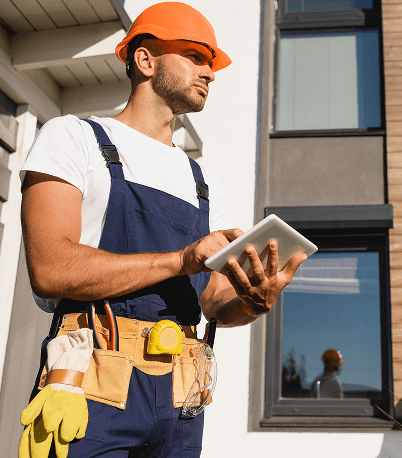 Workers repairing a house